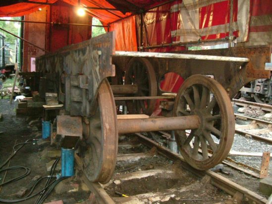 Chassis being lifted clear of the wheels.