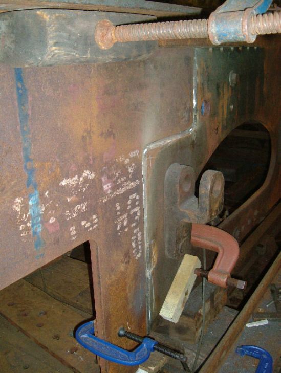 New section of frame plate and top angle being set-up ready for welding. Remains of old plate can be seen in the background.