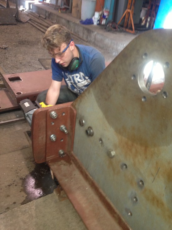 George drills holes in the tender frame top angle
