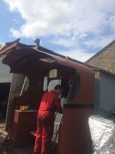 Assembling the cab outside our workshop.